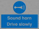 sound-horn-drive-slowly-warehousing-and-delivery-sign~